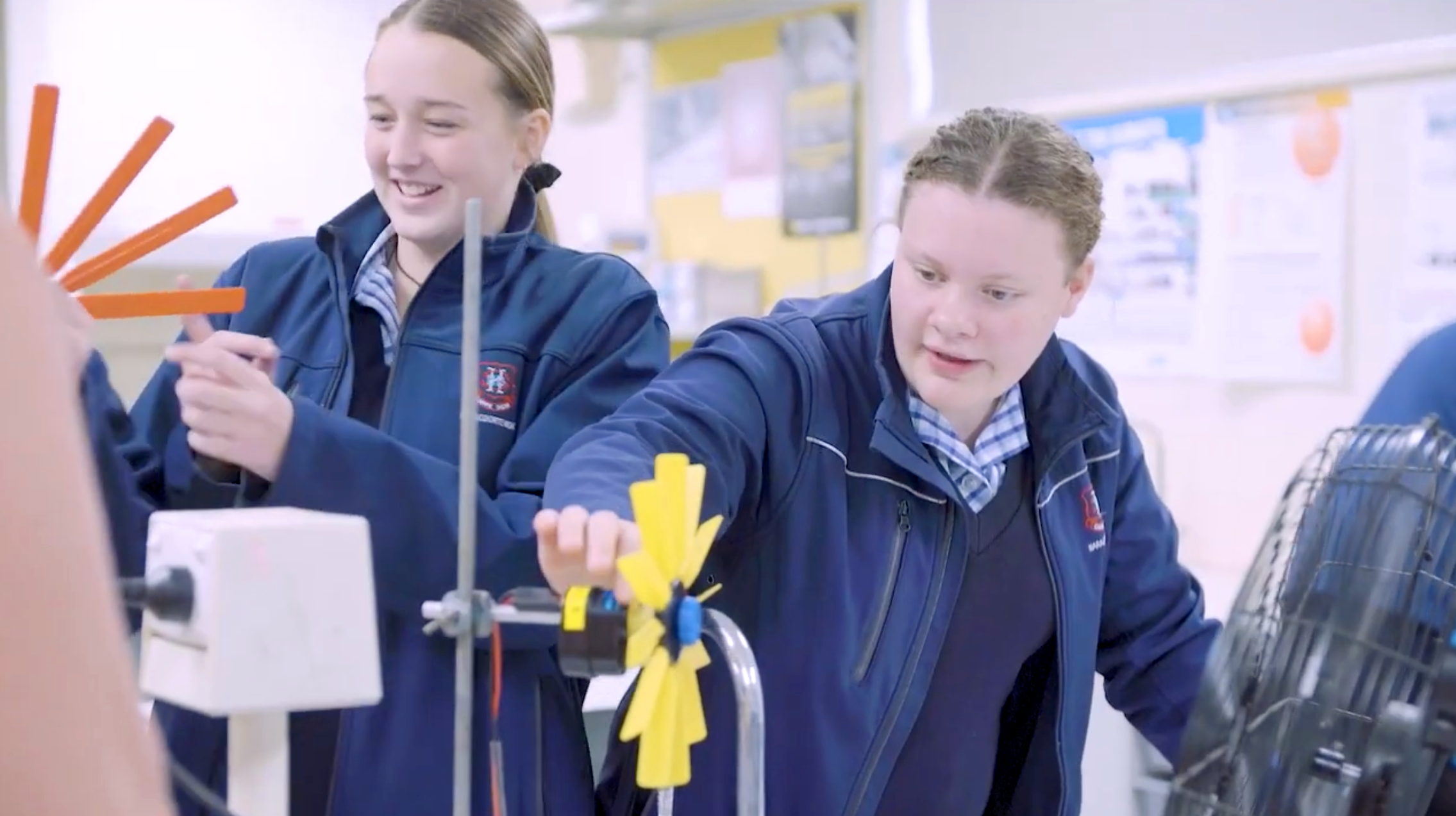 STR Two Female Students And Wind Turbine And Fan