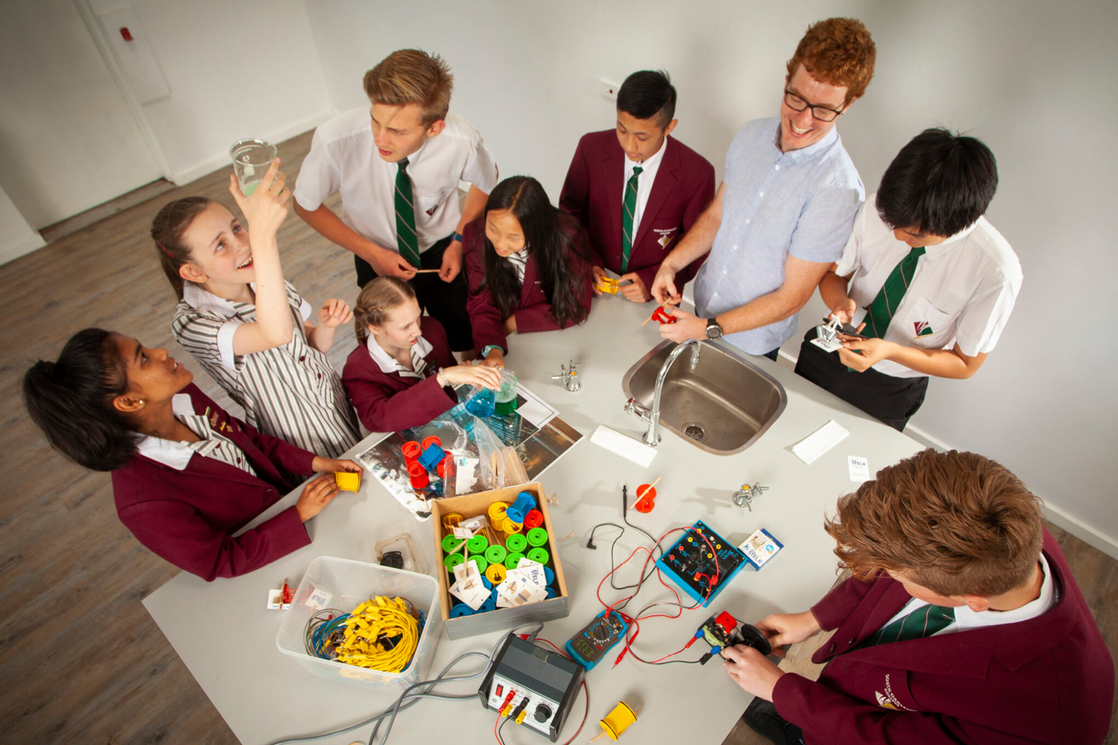 Many Students Around A Table With STELR Kits