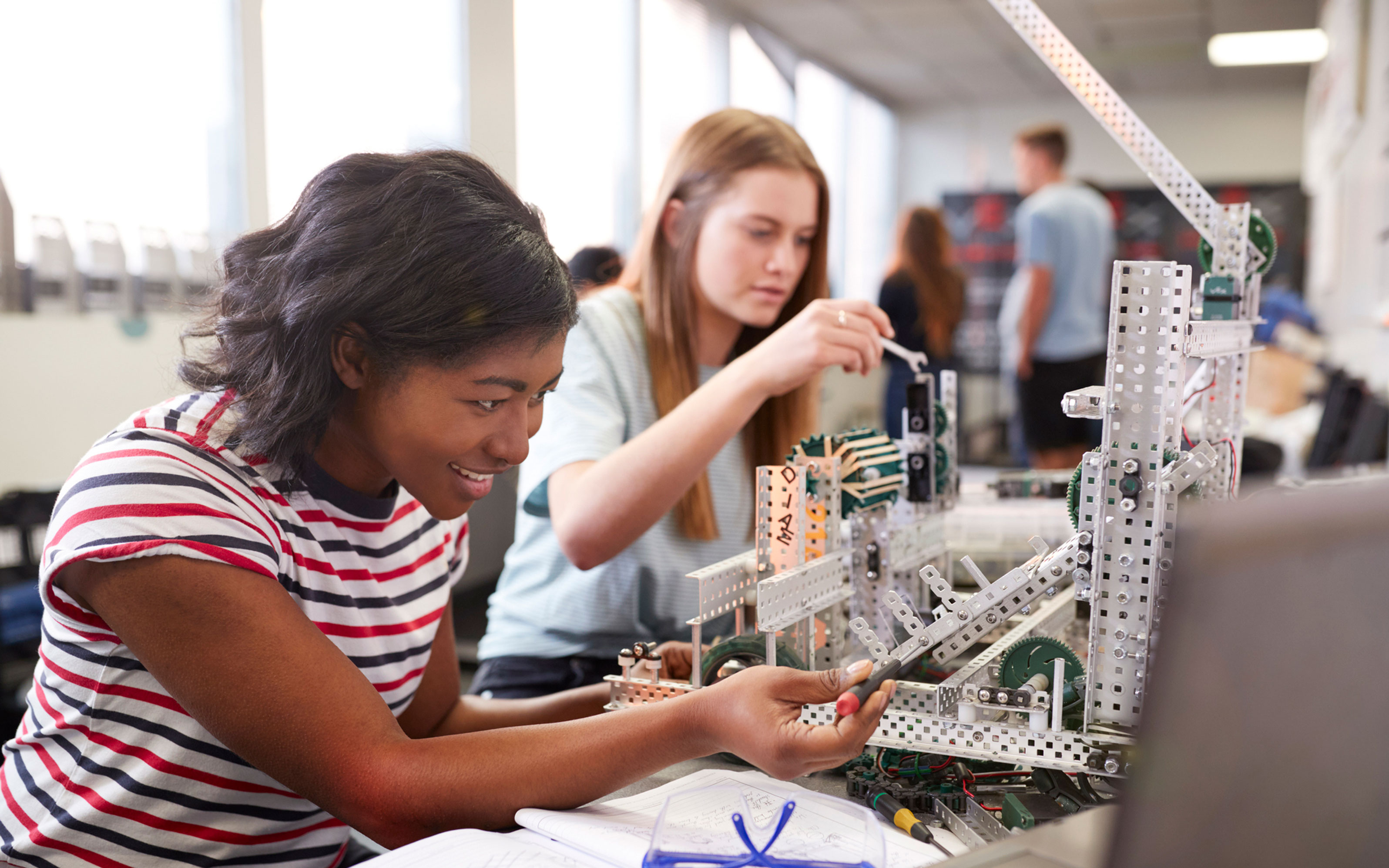 Female students engineers in classroom